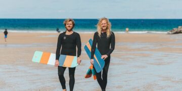Surfers offer free wooden bellyboards to cut plastic pollution