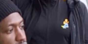 Moment woman tells footy fans to "come outside" for scrap