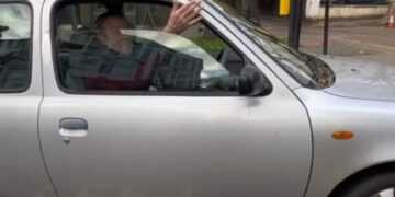 Partially sighted woman collides with stopped driver at a crossing