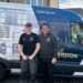Riley Fraser and Derek Wilson standing infront of the company van.