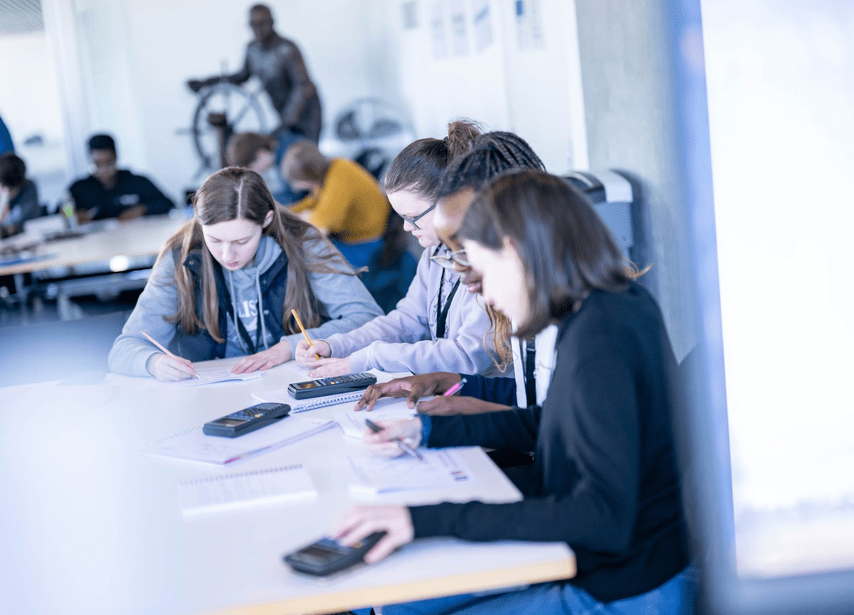 School pupils solving maths calculations