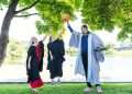 New University of Stirling graduates Heather Gibson (left), from Glasgow, and Robyn MacPherson, from Livingston, shared graduation day with Scottish basketball great Kieron Achara. Heather, 28, and Robyn, 32, graduated with a BA (Hons) Professional Education (Primary) © Stirling University