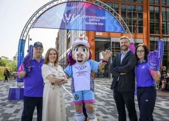 An image of Louisa Mahon, Chief Marketing Officer and Chris Ansell, Director of Live Programmes and Engagement with volunteers and Finnie down by the Clyde where the mile begins.