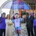 An image of Louisa Mahon, Chief Marketing Officer and Chris Ansell, Director of Live Programmes and Engagement with volunteers and Finnie down by the Clyde where the mile begins.